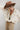 A woman wearing a lightweight jacket with intricate paisley embroidery and embellishments, relaxed, easy fit and brown straw cowboy ha-Embroidered_Paisley_Print_Jacket_-_Ivory-FleaStyle