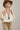 A woman wearing a lightweight jacket with intricate paisley embroidery and embellishments, relaxed, easy fit and brown straw cowboy ha-Embroidered_Paisley_Print_Jacket_-_Ivory-FleaStyle