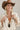 A woman wearing a lightweight jacket with intricate paisley embroidery and embellishments, relaxed, easy fit and brown straw cowboy hat-Embroidered_Paisley_Print_Jacket_-_Ivory-FleaStyle