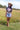 Woman wearing a camel cowboy hat and Choosin_Texas-Graphic-T-Shirt-Yellow in a field-Fleastyle