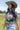 Woman wearing a camel cowboy hat and Choosin_Texas-Graphic-T-Shirt-Yellow in a field-Fleastyle