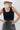 A woman wearing  an ivory cowboy hat, and wide-leg patterned pants and a form-fitting knit tank featuring a flattering scoop neckline with studded detailing for a subtle western edge-Studded Knit Tank Top - Black-FleaStyle