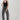 A woman wearing a black studded tank, easy barrel-leg silhouette leopard print jean, silver cowboy boots, and an ivory cowboy hat-Leopard_Print_Barrel_Jeans-FleaStyle