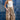 Woman in a Ruched_Wide_Leg_Star_Print_Pant with adjustable ankle ties, and red cowboy boots-Fleastyle