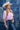 Woman in an ivory staw cowboy hat, Puff Sleeve Blouse with Ties - Lavender and open necklace-Fleastyle