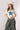 A woman  wearing a cream t-shirt with a large blue star applique, Washed Camo Pants with Ruched Ankle, an ivory cowboy hat-Denim Star Short Sleeve Graphic T-Shirt - Ivory-FleaStyle