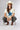 A woman  wearing a cream t-shirt with a large blue star applique, Washed Camo Pants with Ruched Ankle, an ivory cowboy hat-Denim Star Short Sleeve Graphic T-Shirt - Ivory-FleaStyle