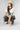 A woman  wearing a cream t-shirt with a large blue star applique, Washed Camo Pants with Ruched Ankle, an ivory cowboy hat-Denim Star Short Sleeve Graphic T-Shirt - Ivory-FleaStyle