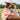 Woman sitting outdoors in a field wearing Lenny Wool Short-Brim Hat - Blush-Fleastyle