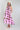 Woman wearing a Monstera-Leaf-Print-Halter-Maxi-Dress-Pink and a Brooks Straw Cowbowy Hat White-FleaStyle