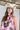 Woman wearing a Monstera-Leaf-Print-Halter-Maxi-Dress-Pink and a Brooks Straw Cowbowy Hat White-FleaStyle