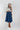 Woman wearing a Lace-Up-Corset-Midi-Dress-Dark-Denim and gray flat brim hat -Fleastyle