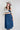 Woman wearing a Lace-Up-Corset-Midi-Dress-Dark-Denim and gray flat brim hat -Fleastyle