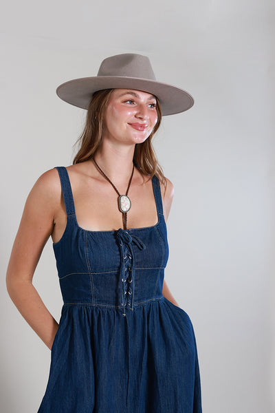 geisha designs corset denim midi dress From city chic to country glam this denim corset midi dress is the definition of versatile. Style it with clear heels and a structured bag for a polished night-out look, or go