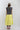 Woman wearing a You-Shook-Me-All-Night-Long-Boxy-Muscle-Tee and lime striped skirt with a beige trucker cap-Fleastyle