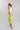 Woman wearing a white sleeveless top and Striped Midi Skirt with Elastic Waist - Lime with a blush flat brim hat and squash blossm necklace-FleaStyle