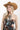 Woman wearing a western tapestry lace up mini strapless dress, cowboy hat and blue cowboy boots-FleaSyle 