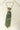 Green-Upcycled-Vintage-Tie-Necklace with a star-shaped vintage brooch and gold chain on a light wooden door-Fleastyle
