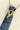 Upcycled-Vintage-Tie-Necklace-Gray with a gold chain and vintage gold brooch-Fleastyle