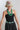 A woman wearing a kahki trucker hat with a colorful embroidered butterfly patch sourced from the Long Beach Flea Market-Butterfly Patch Trucker Hat - Khaki-FleaStyle