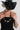 A woman wearing a black cowboy hat and a bold necklace with sculptural, and a little industrial, oversized antiqued silver-tone beads with stacked black disc details and smaller dark beads--Vintage_Black_Silver_Sculptural_Bead_Necklace-FleaStyle
