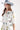 Woman wearing a white Floral-Print-Midi-Shirt-Dress-with-Belt-White and dusty blue decorated cowboy hat-FleaStyle