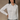 Front view of the fitted white button-down shirt on a model, showing the pointed collar and long sleeves.