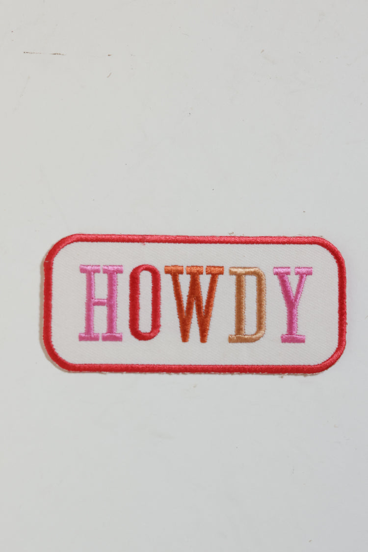 Embroidered patch with  shades of pink letters 'HOWDY' text-Flea Style. 