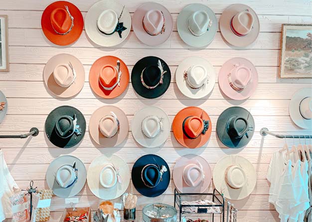 Decorated and colorful hats on a hat wall