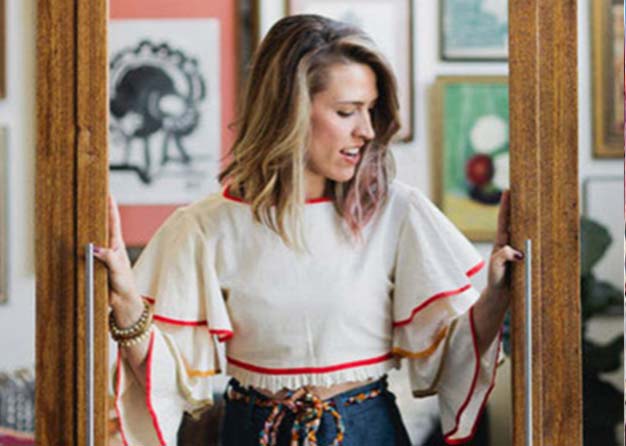 woman walking through a set of doors