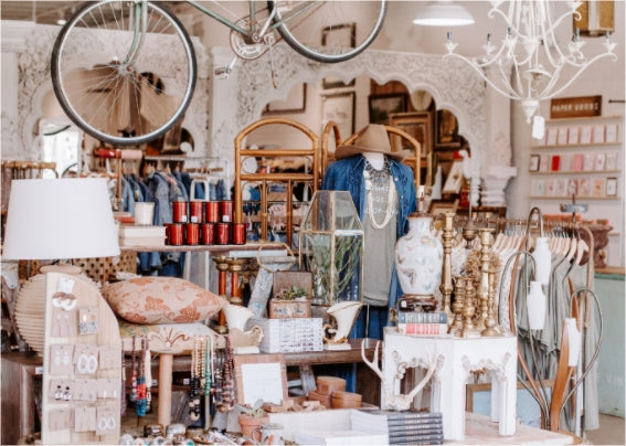 interior of a store with clothing, accessories and hats